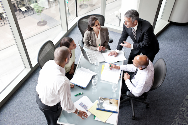 male and female business people in a meeting