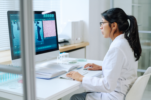 side view of young hispanic female scientist