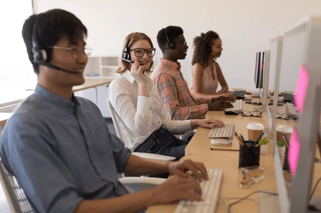 team of contact center agents in front of their computers