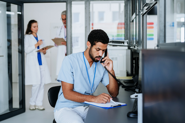 young multiracial doctor sitting at reception