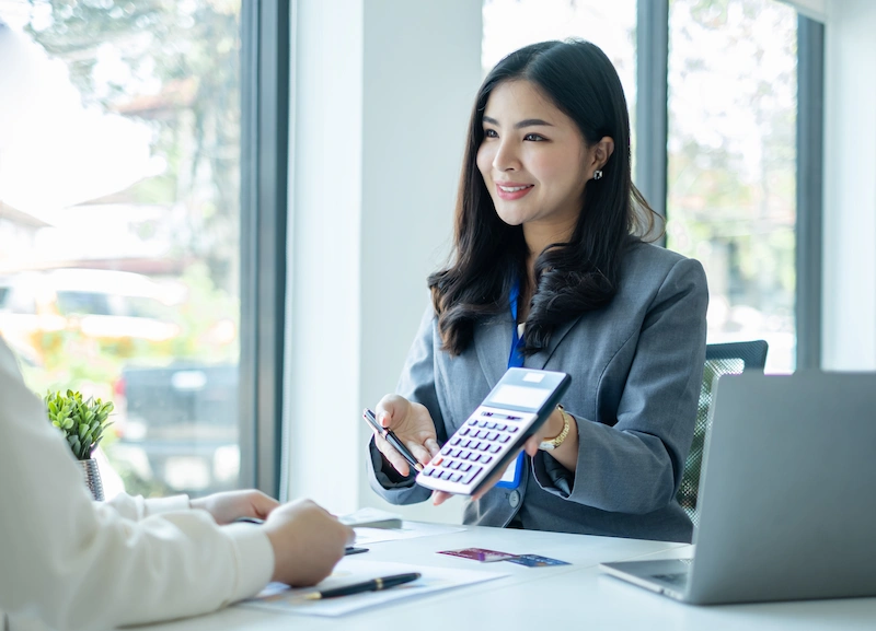 accountant showing the computation in the calculator