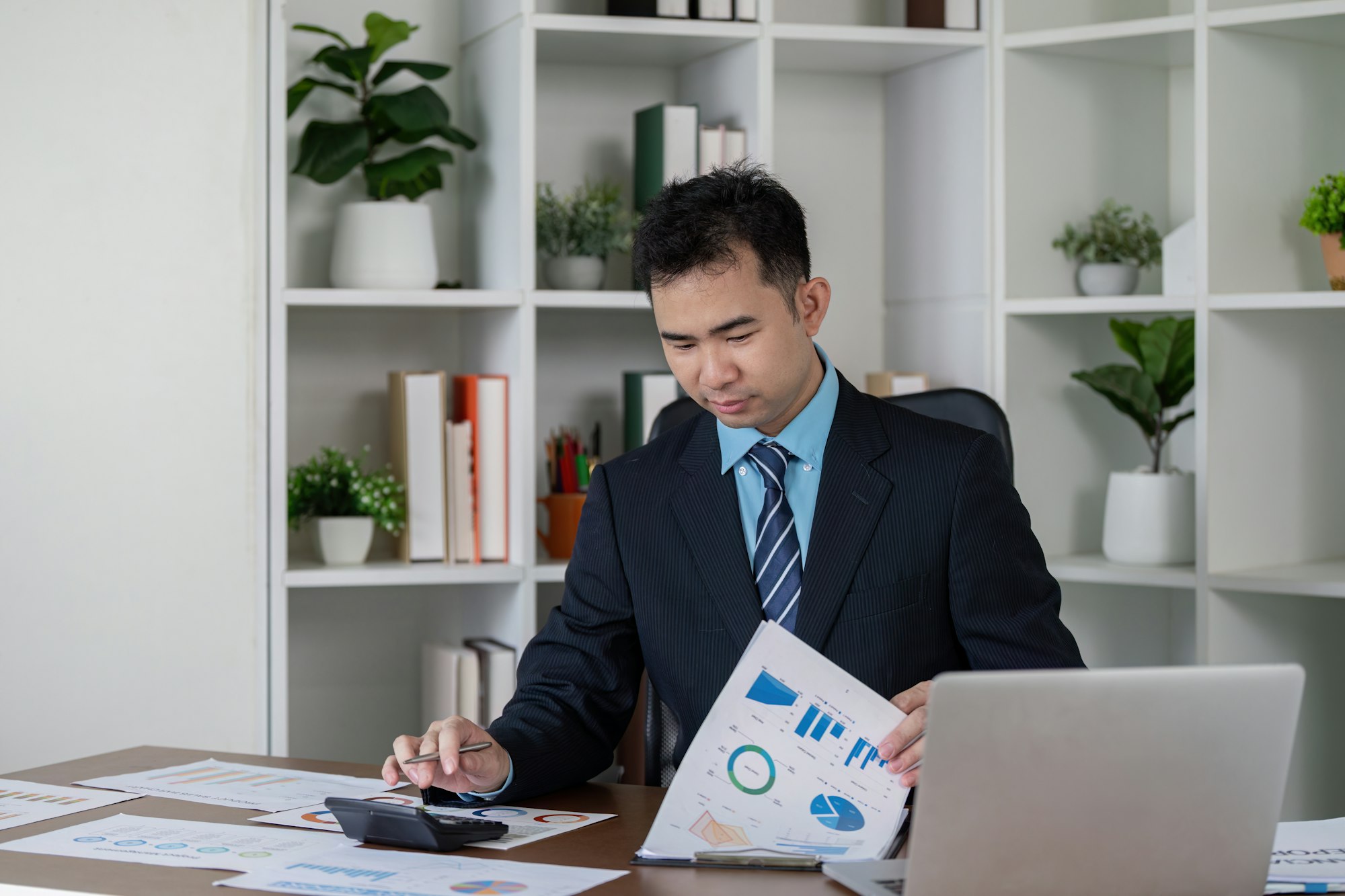 Focused Accountant Reviewing Financial Data for Effective Business Strategy