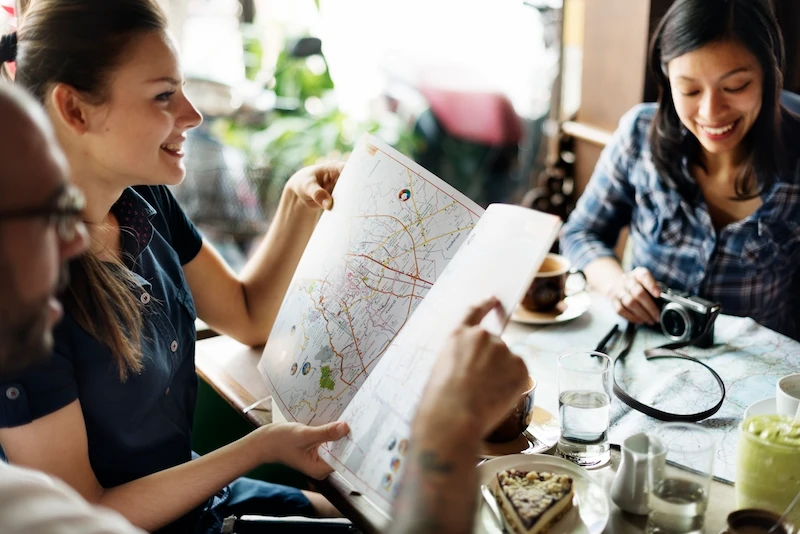 group of travelers checking their map