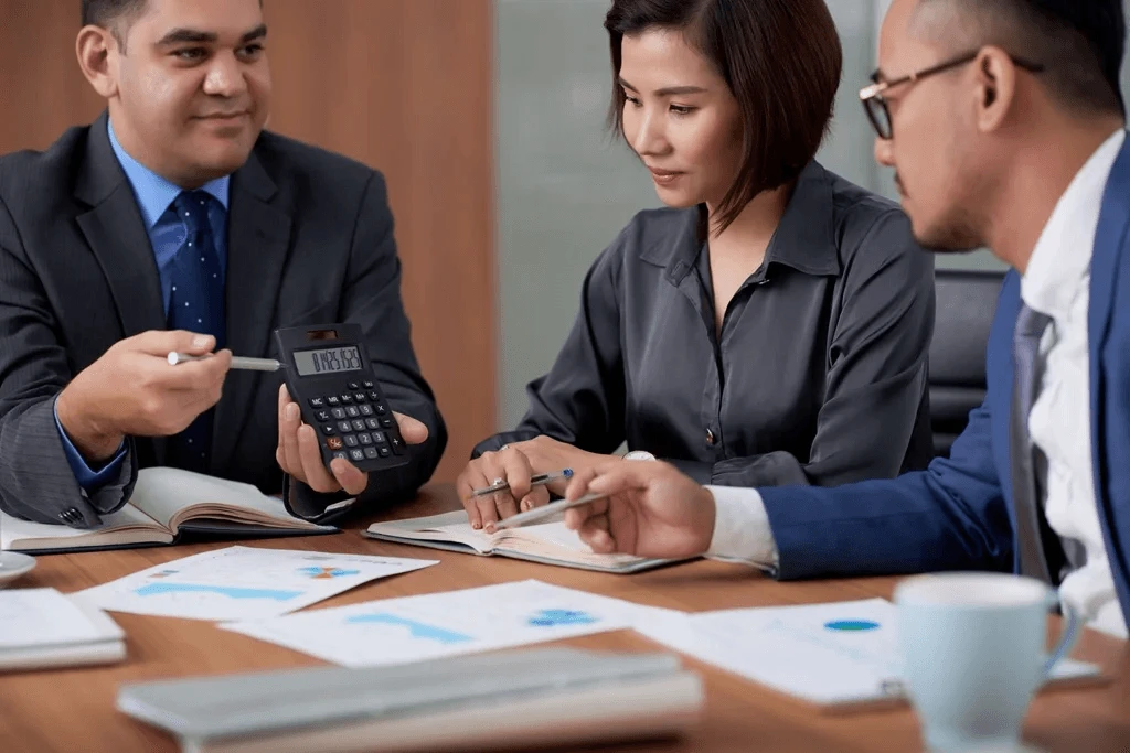 team of accountants analyzing financial data for a client outsourcing financial services to the Philippines