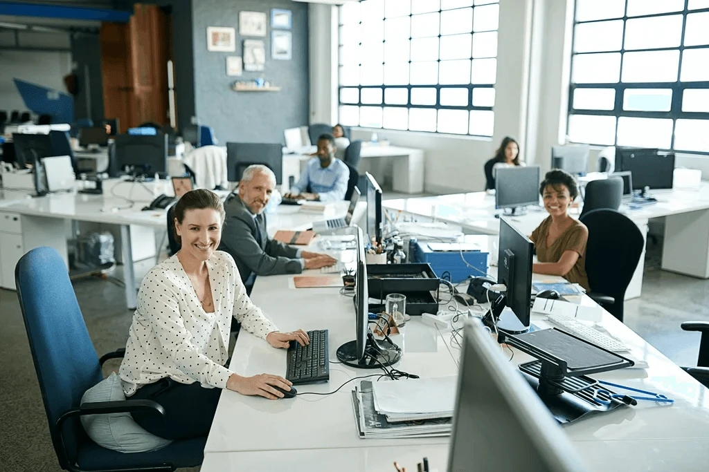 team of employees in their workstations