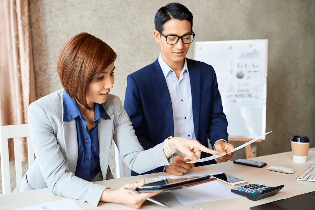 accountant and bookkeeper working on financial statements