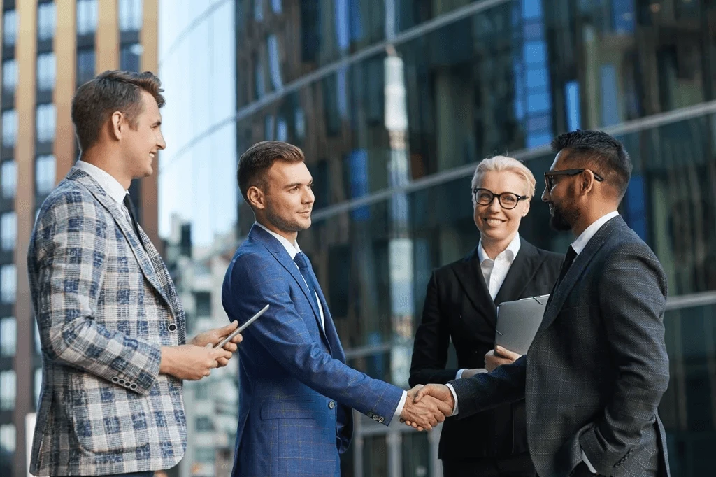 businessmen shaking hands as a form of formal agreement