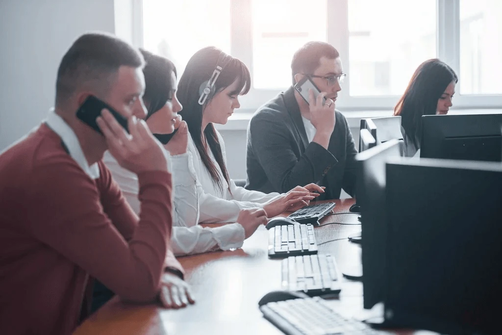 customer service agent handling phone calls as part of their phone support outsourcing services