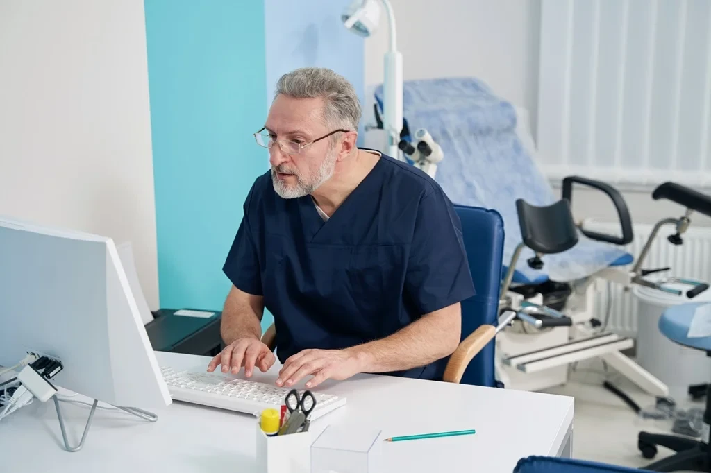 dentist managing online reviews using his computer