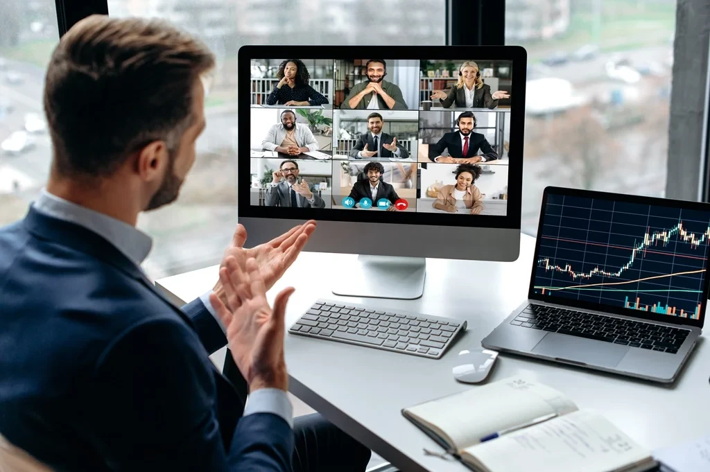 executive in a virtual meeting about economics with his outsourced team