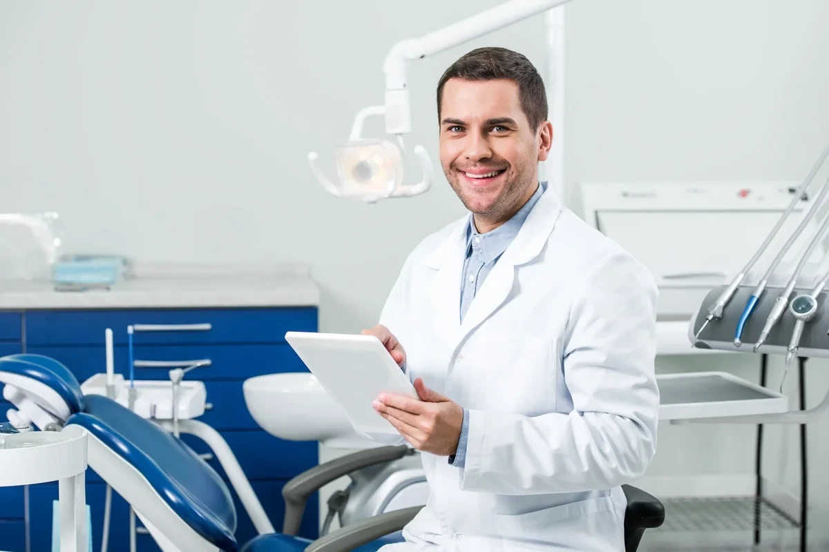 licensed dentist working in a small clinic