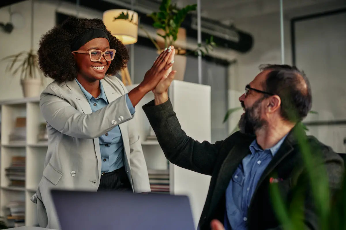 business people high five on employee retention