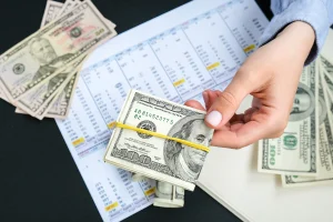 business woman displaying a spread of cash