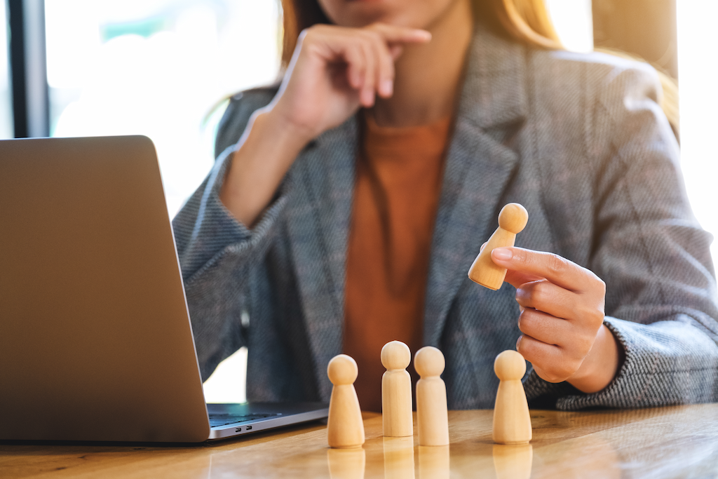 businesswoman leader holding chess piece