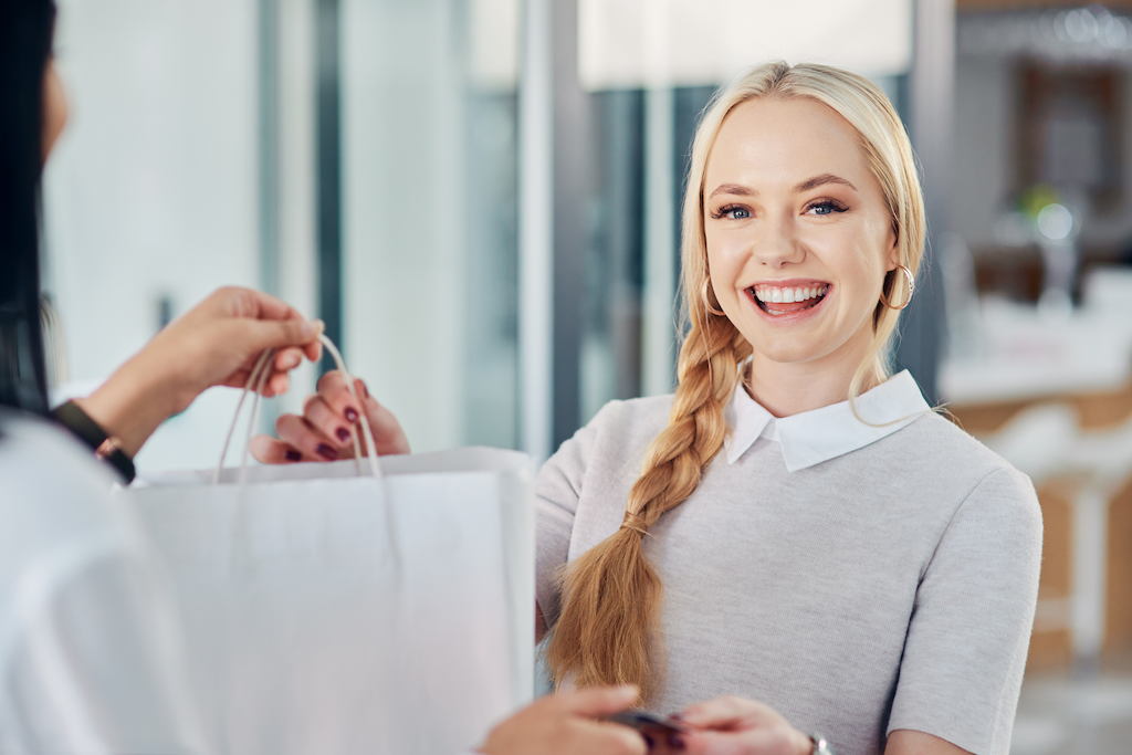 cropped shot of a young woman making a purchase