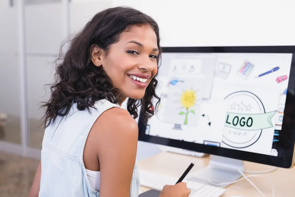 smiling businesswoman designing logo