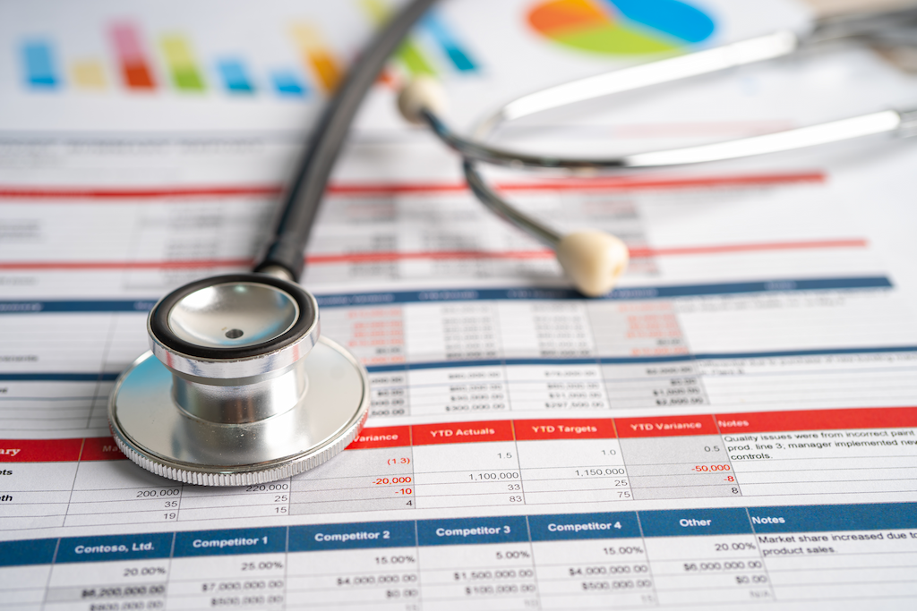 stethoscope on chart graph for analysis