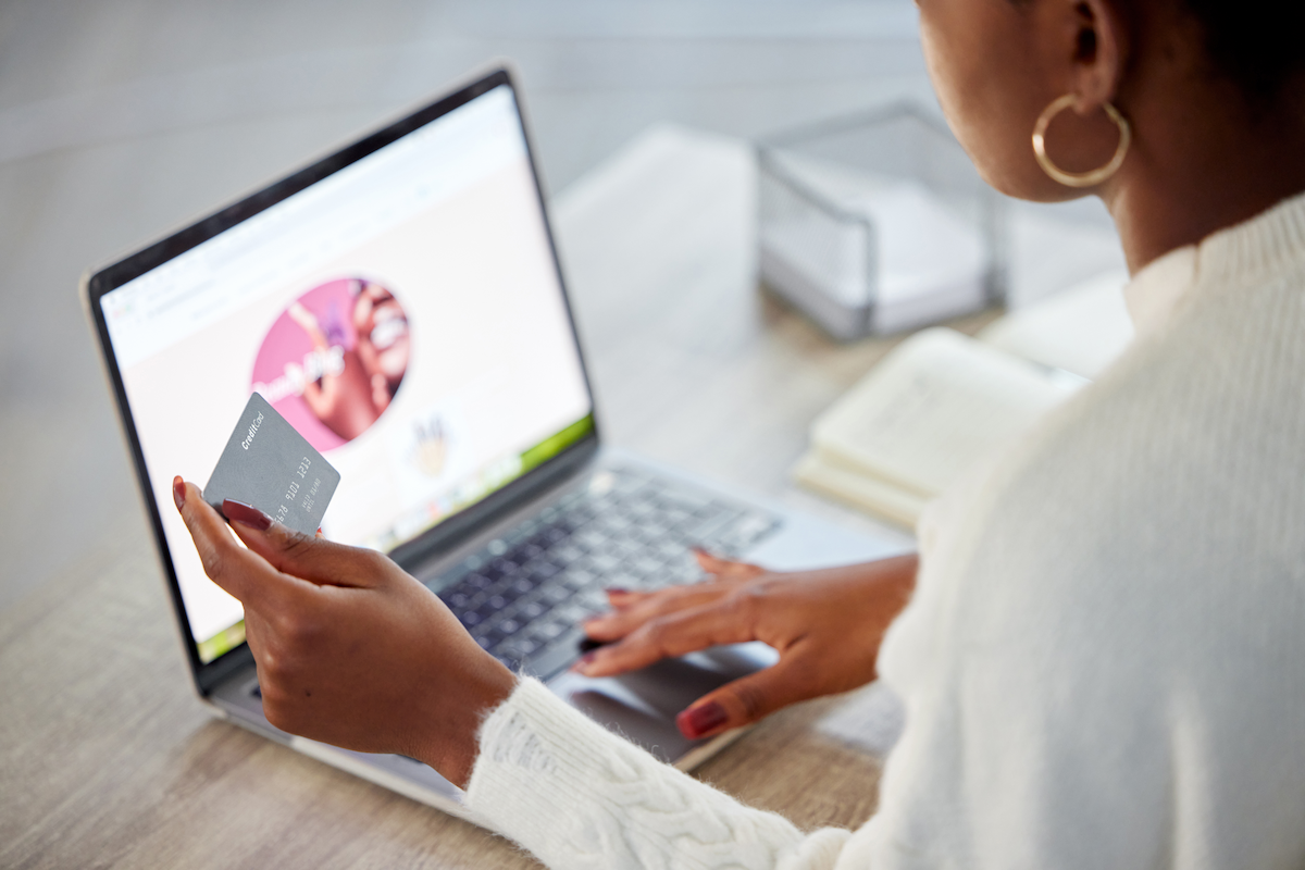 woman using a laptop and shopping online