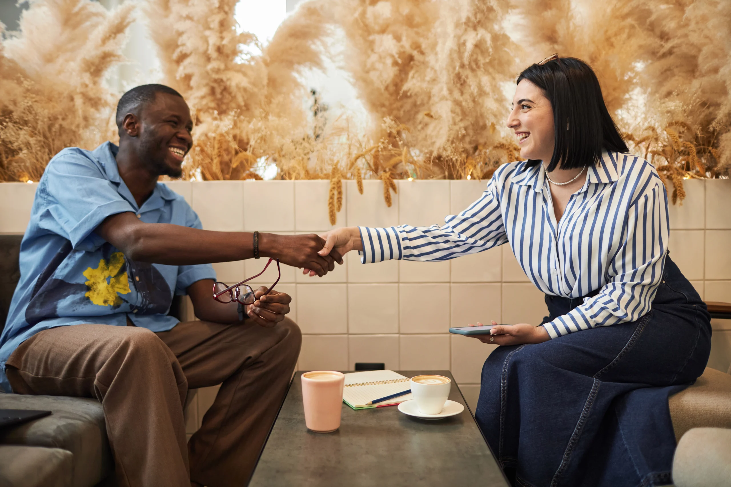 business people shaking hands on brand loyalty