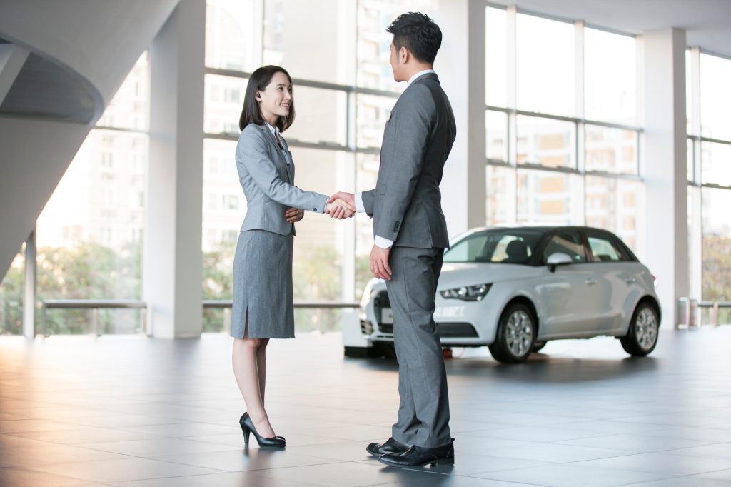 Car saleswoman building strong relationships with customer 