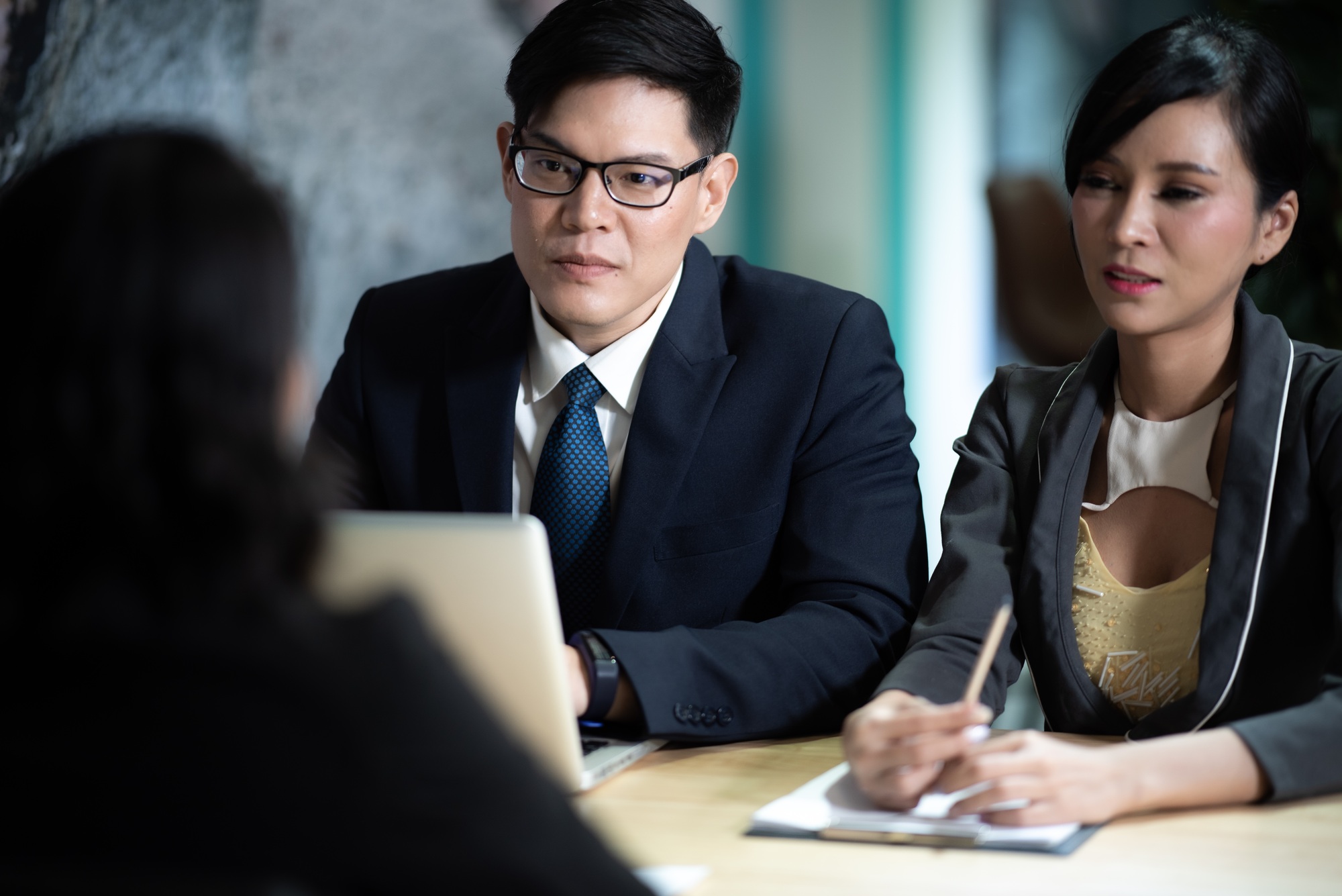 Human resources manager conducting job interview with applicants in office