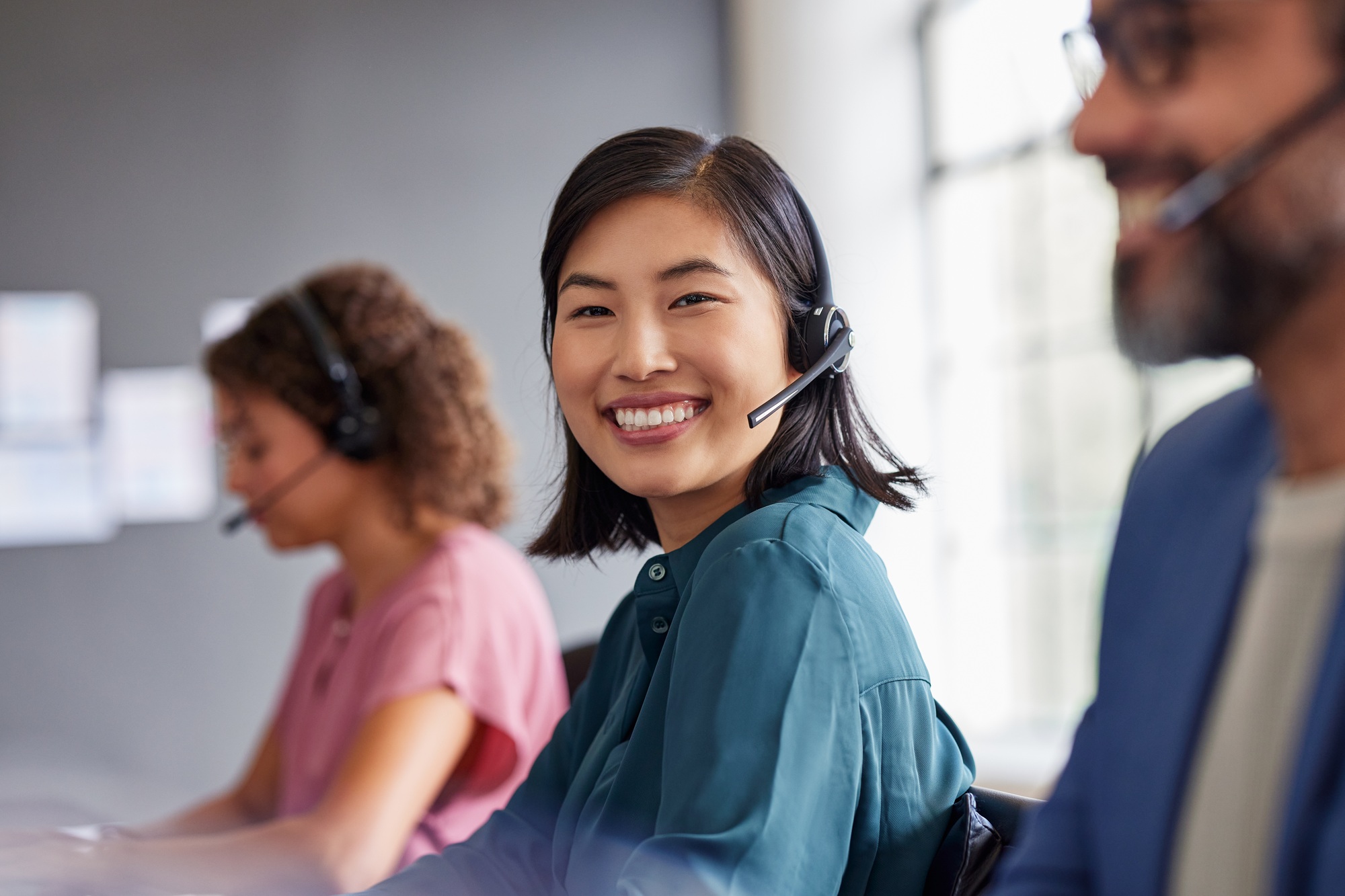 Portrait of smiling chinese customer service agent