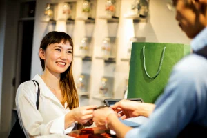 smiling woman standing due to customer delight