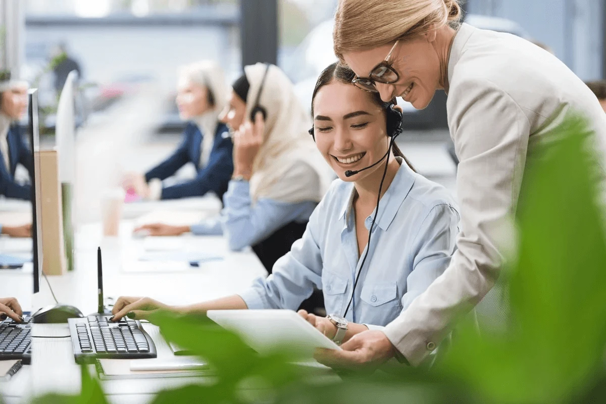 Team leader discussing the customer care outsourcing process with the new employee