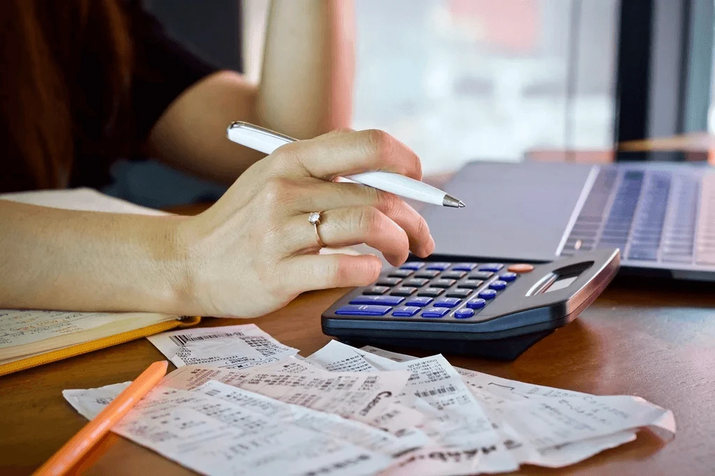 accountant reviewing expenditures for tax-paying purposes