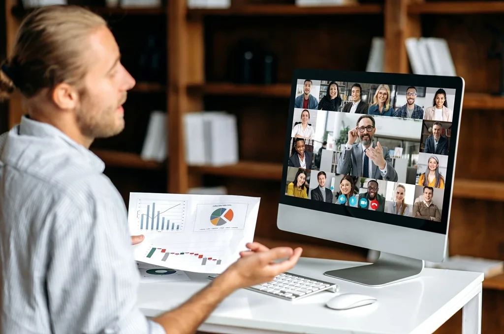 business owner discussing business matters with outsourced team virtually