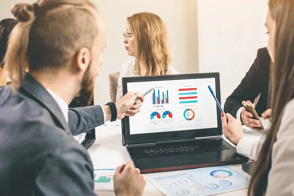 business owners analyzing customer satisfaction metrics