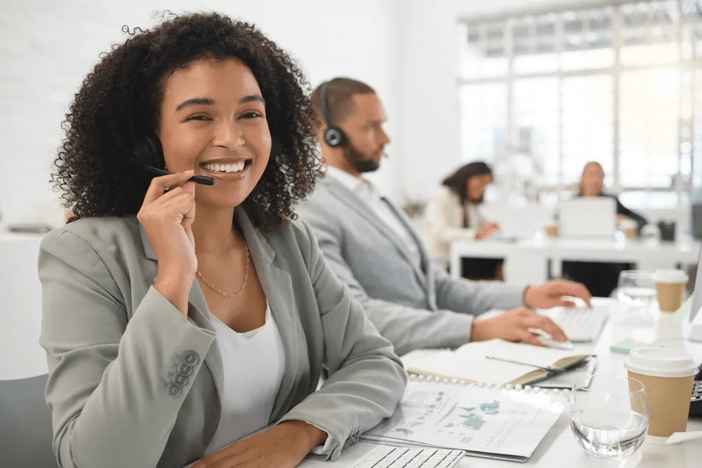 call center agent analyzing paperwork related to customer satisfaction
