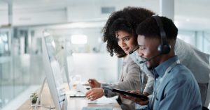 Call center computer, happy mentor and people for telemarketing sales, outsourcing or check onboard