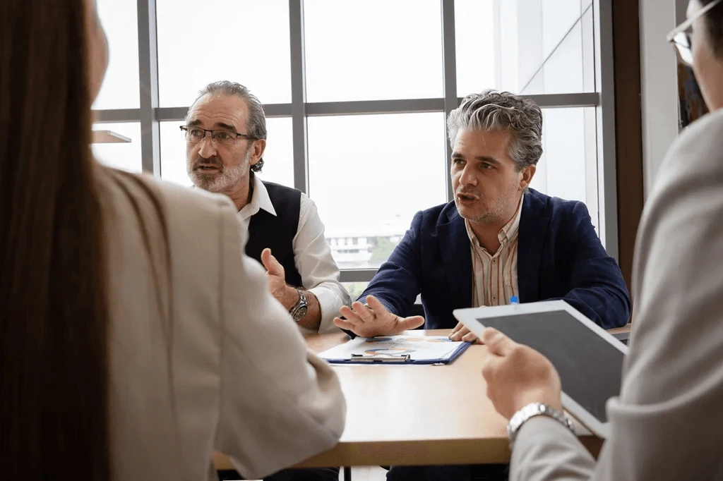 executives discussing their customer care process of their business