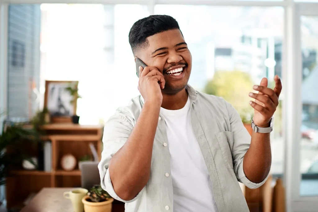happy customer talking to a customer service agent on the phone