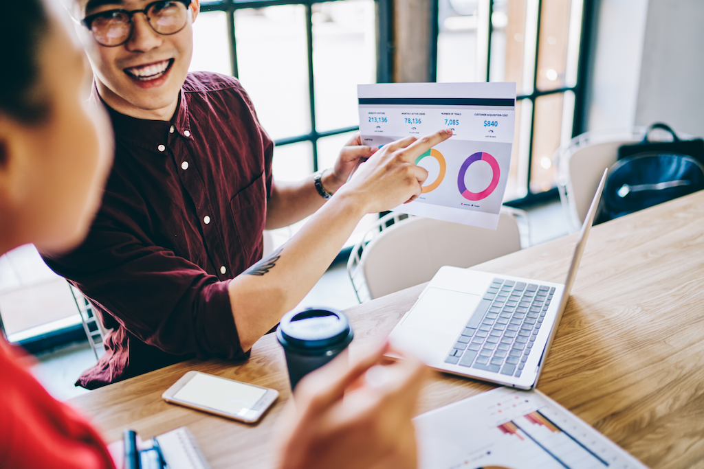smiling coworkers checking reputation marketing