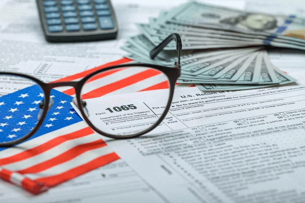 tax filing form and a pile of dollars symbolizing tax planning