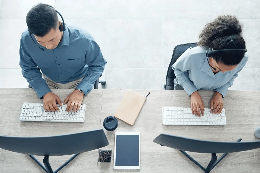 top view of two busy customer service agents