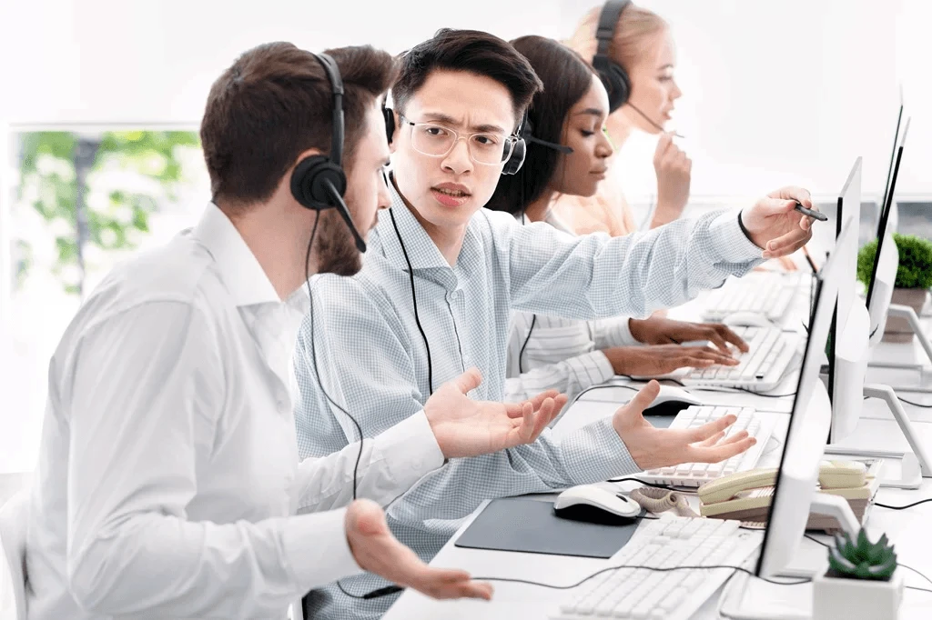 call centers agents discussing the customer pain points