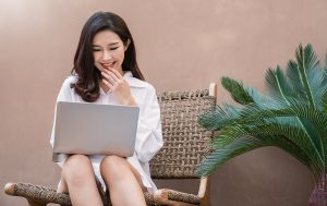Portrait smile beautiful business asian creative designer woman suit working virtual computer