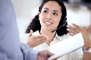 skilled customer service agent explaining her process to the team leader