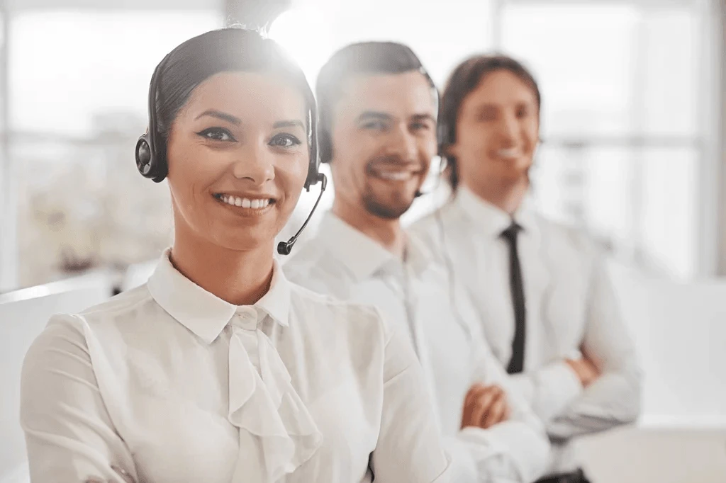 team of customer service agents with arms crossed