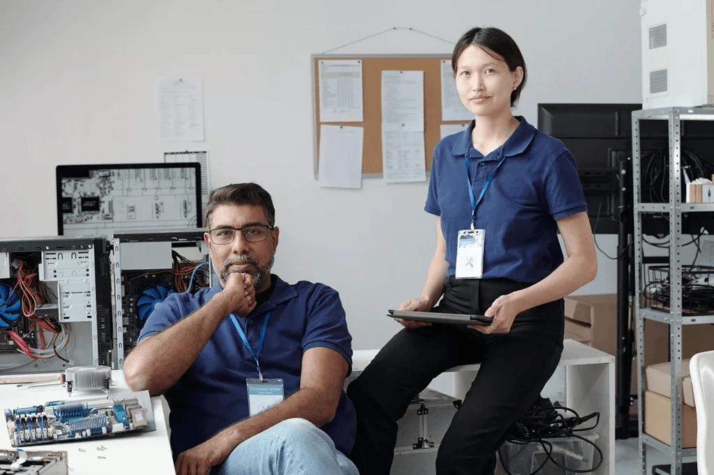 two technical support professionals handling hardware problems