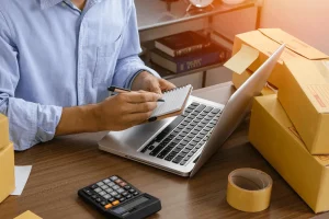 business owner doing ecommerce bookkeeping in-house