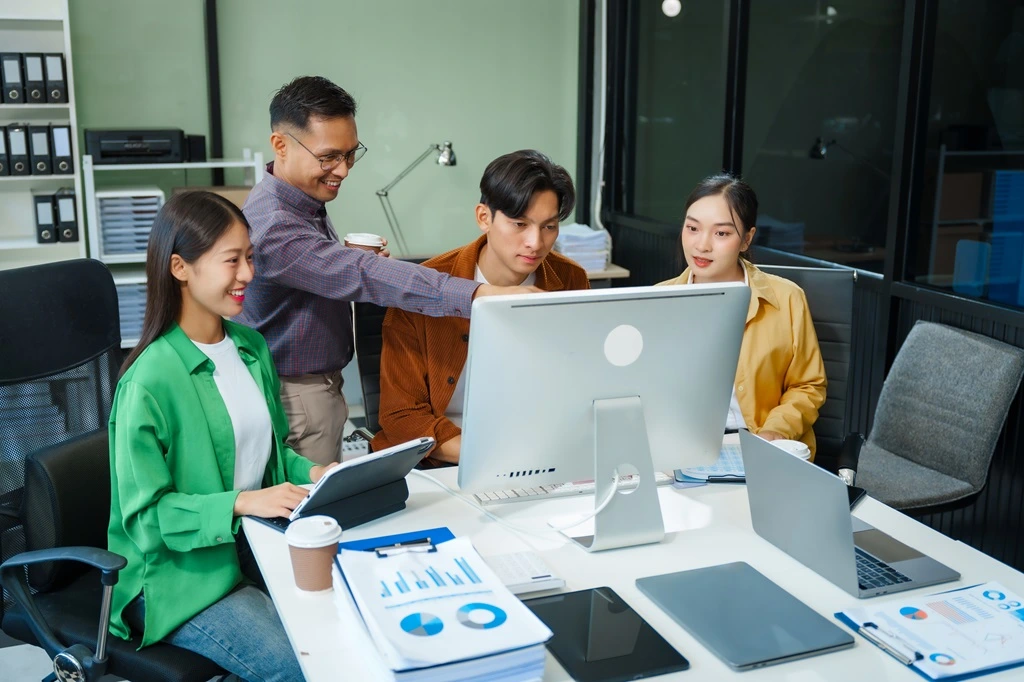 professionals implementing outsourcing strategies for global support