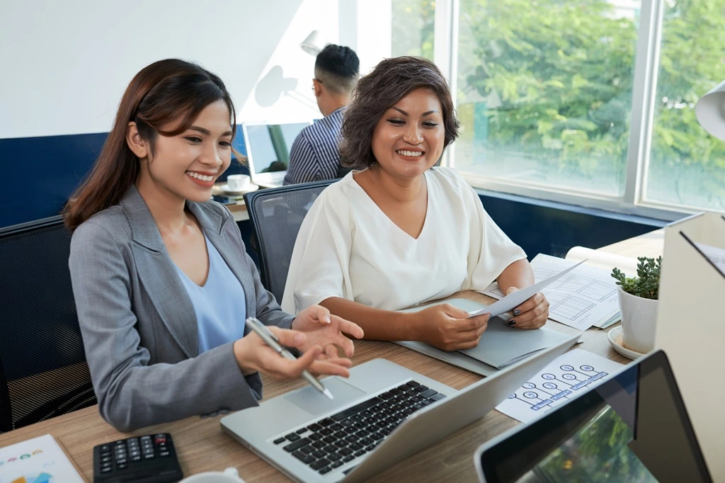 team leaders reviewing outsourcing strategies for global operations