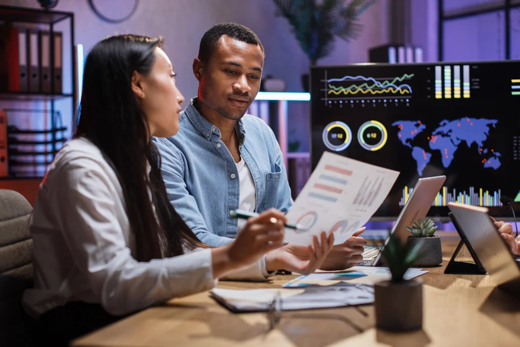 business professionals analyzing data and technology trends to adapt to digital disruption