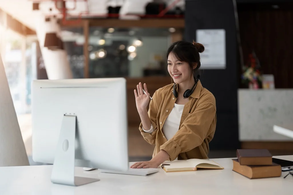 freelancer using laptop showcasing examples of the gig economy
