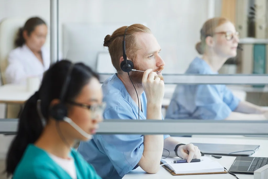 healthcare professionals collaborating with a doctor call center to improve patient communication and support