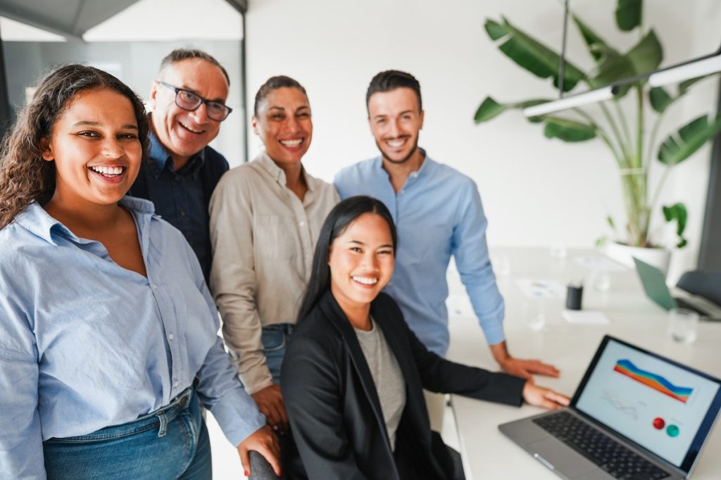 Team of outsourcing staff smiling